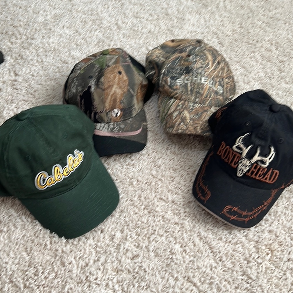 Set of four men’s ball caps all either new never worn or like new condition